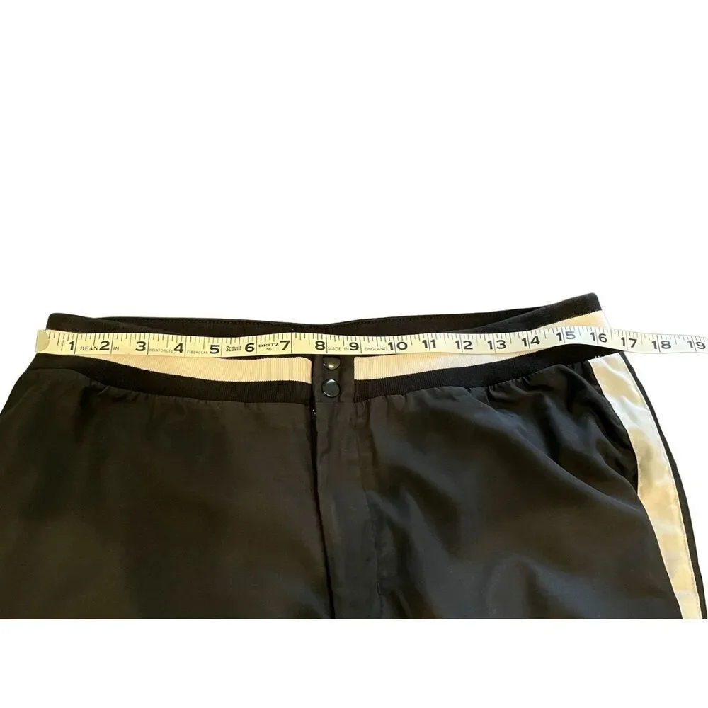 Nike black track pants with white side stripes and ankle zippers - L